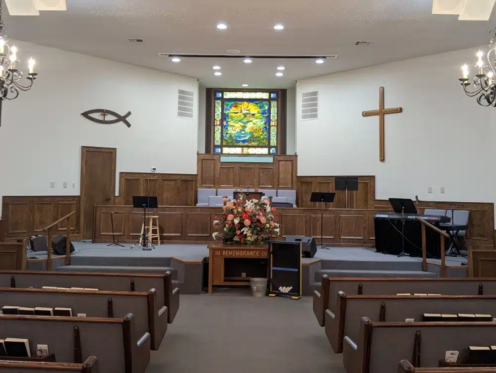 Interior of Comfort Baptist Church looking down the center aisle toward the altar in Comfort, Texas